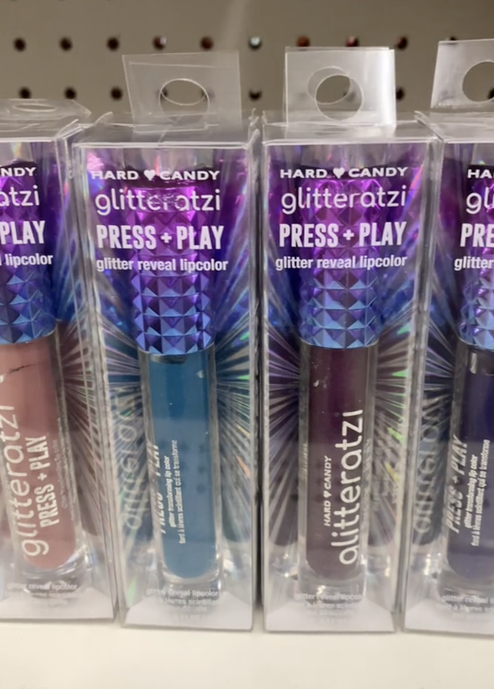 Display of Hard Candy lip glosses at Dollar Tree