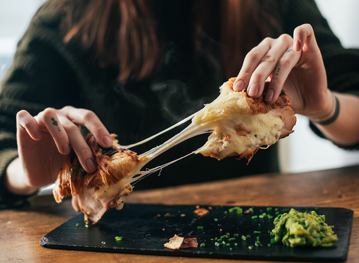 10 Signs You’re Eating Too Much Cheese, According to Doctors