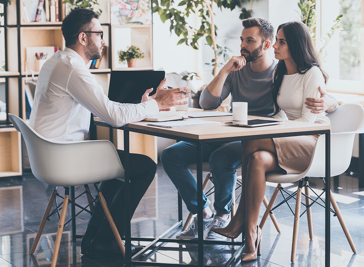 A couple meet with their financial planner.