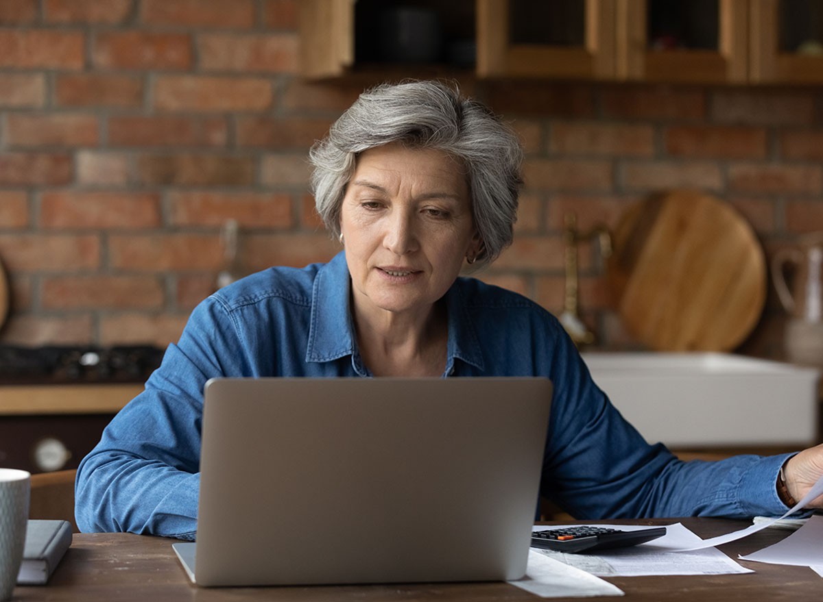 A woman using laptop at home