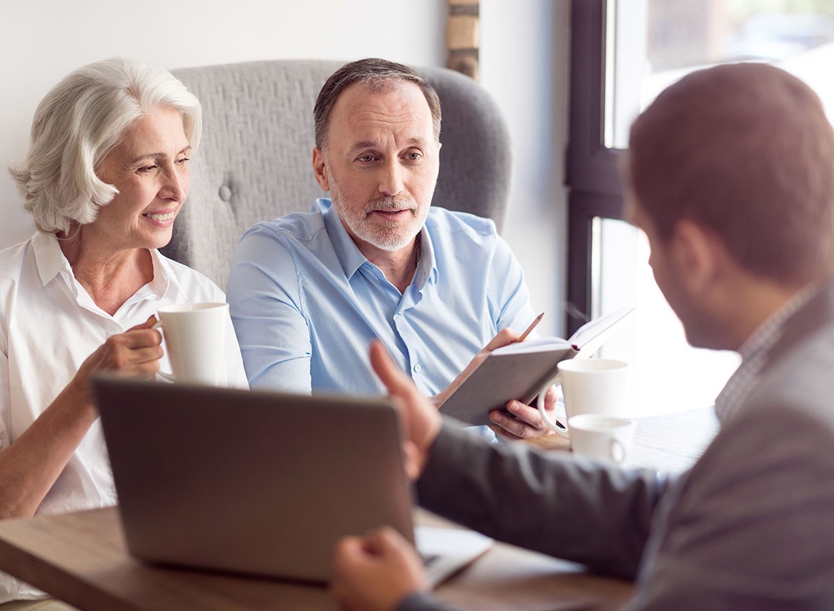 A couple meet with their financial advisor.