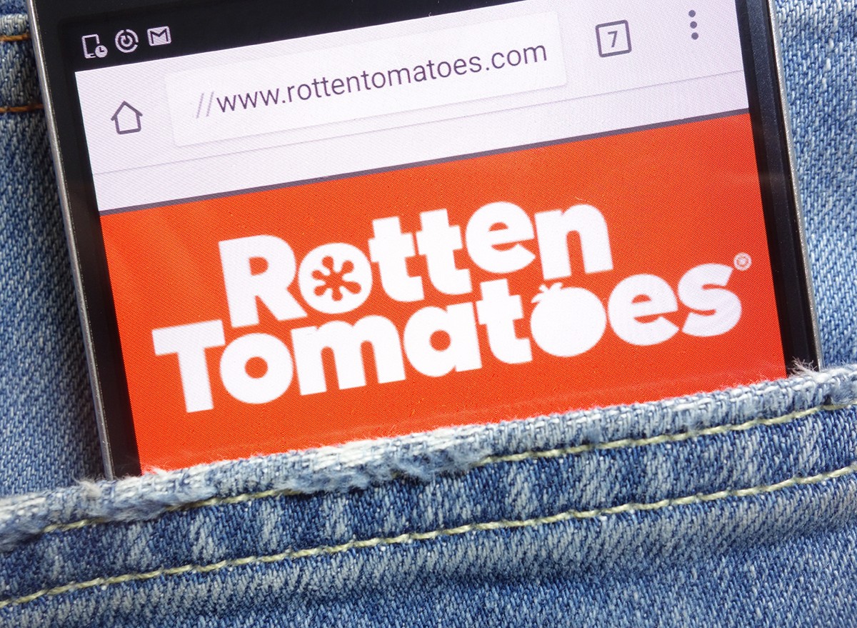 Rotten Tomatoes app on a phone the back pocket of a pair of jeans
