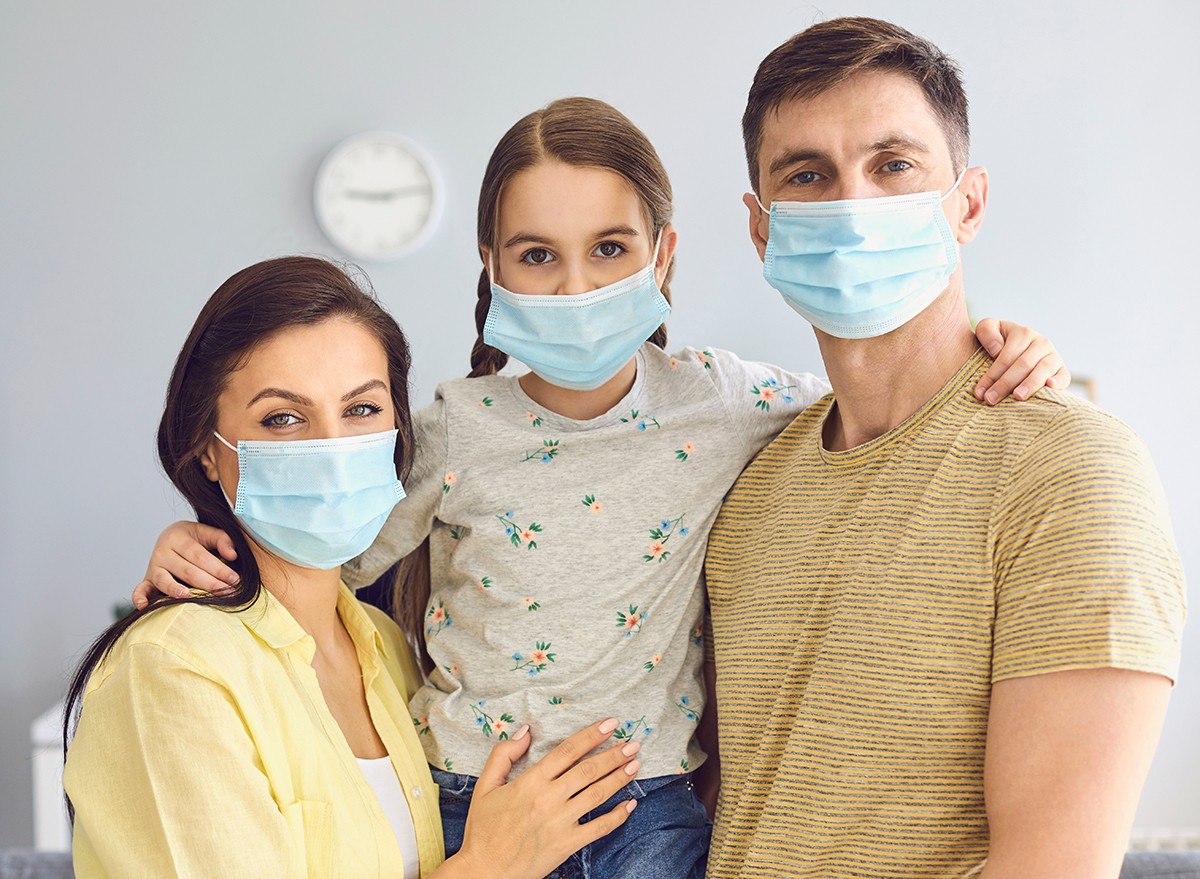 A family wearing Covid face masks