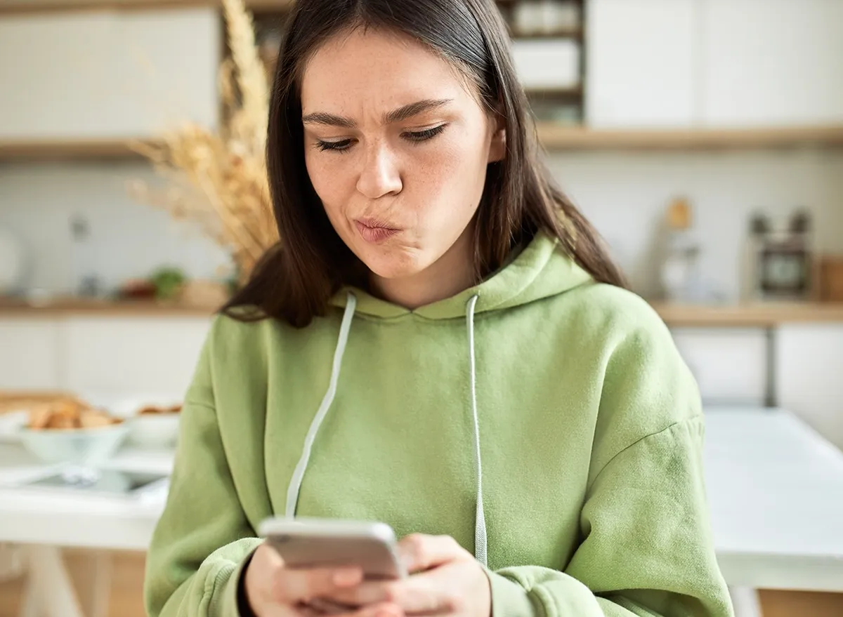 Woman looking at text messages on her phone