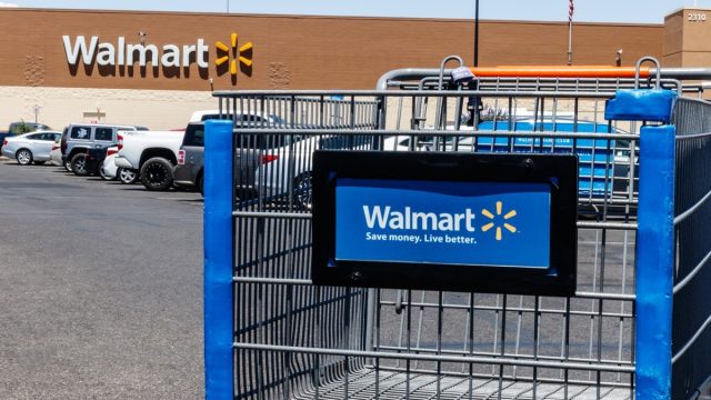 walmart shopping cart in foreground with the store in the background