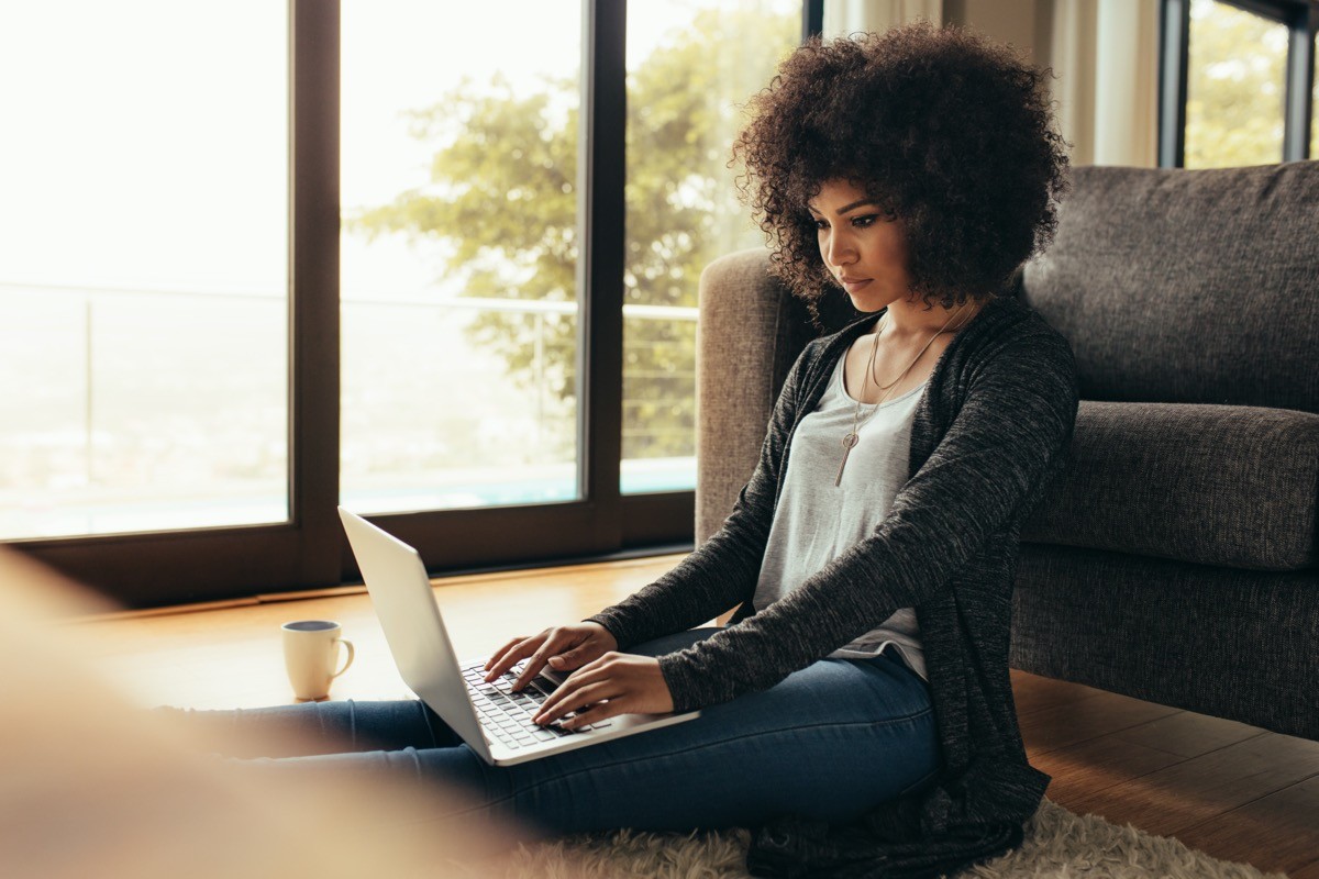 young woman using laptop