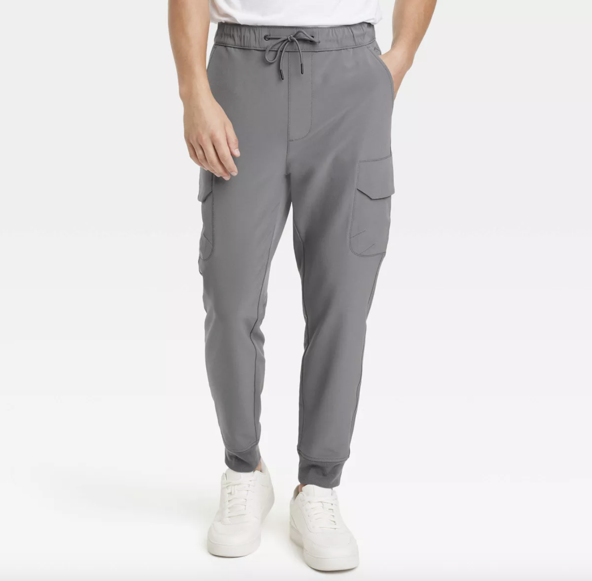 cropped shot of a man wearing gray joggers