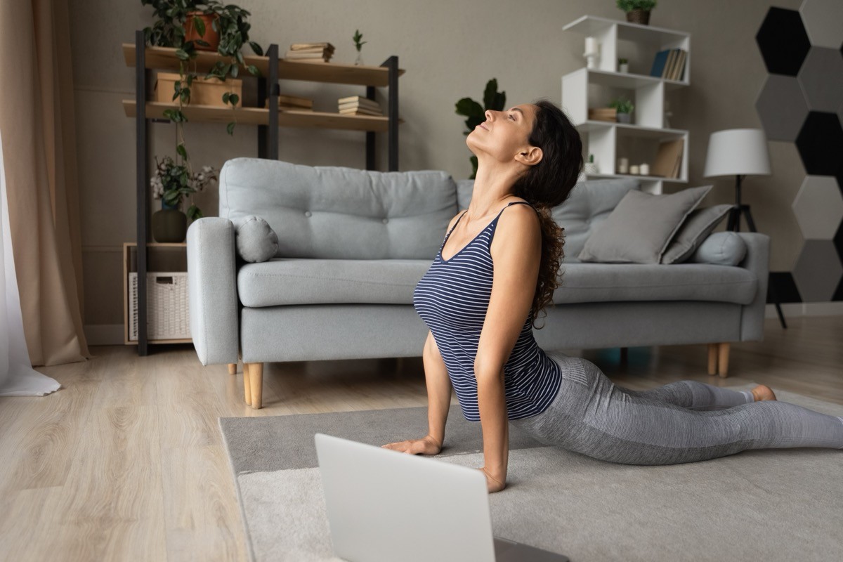 woman doing a yoga workout at home