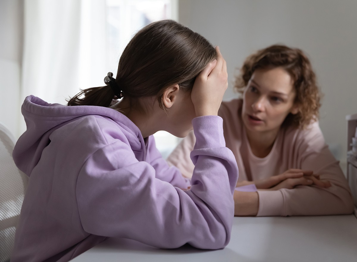 A mother having a serious conversation with her teen daughter