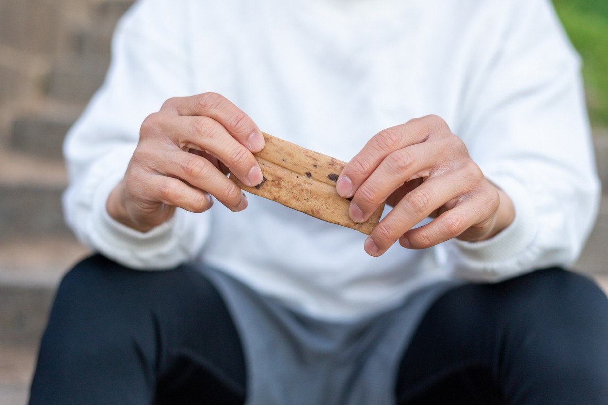 A close up of a person eating a protein bar