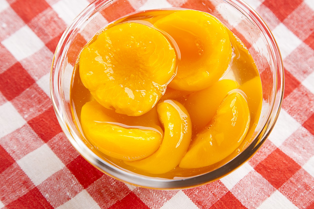 Canned peaches in a bowl