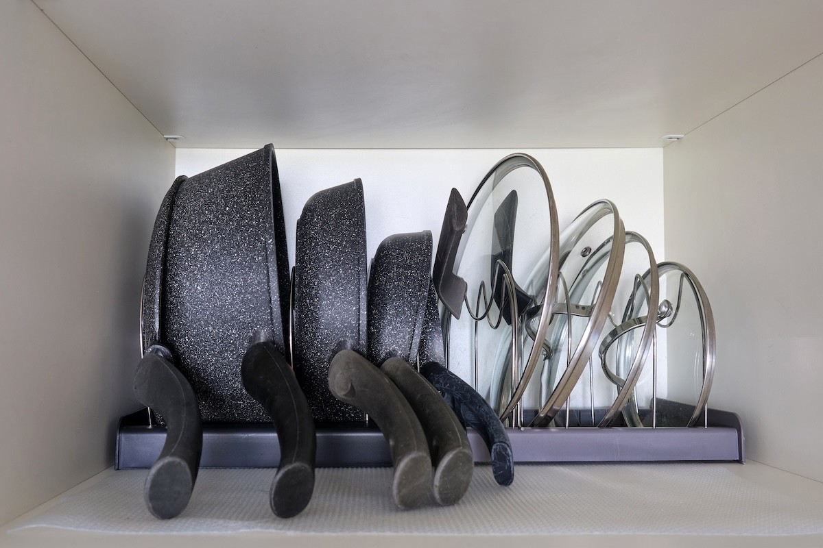 pot and pan organizer in cabinet
