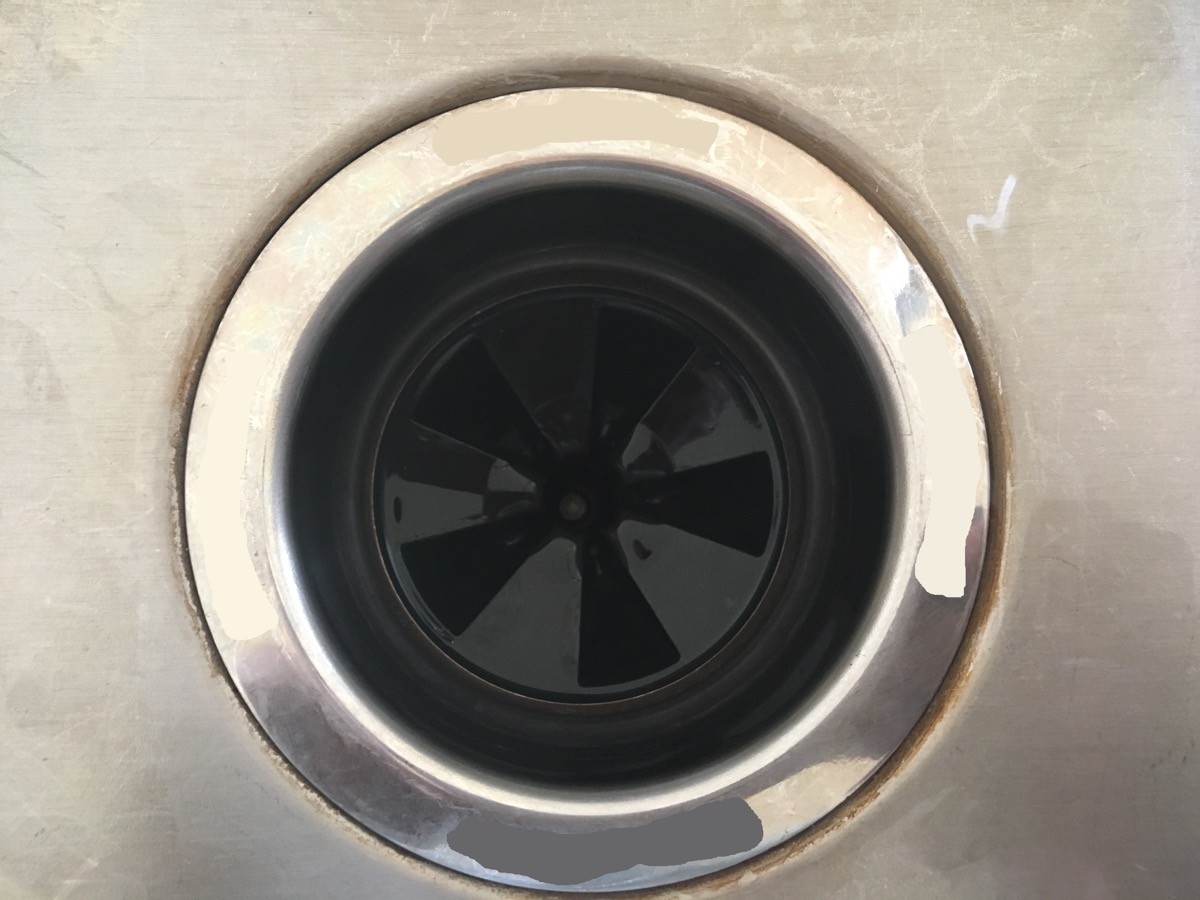 Garbage disposal in steel sink