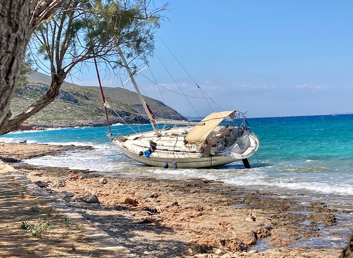 A wrecked sailboat after a storm on the coast of Greece