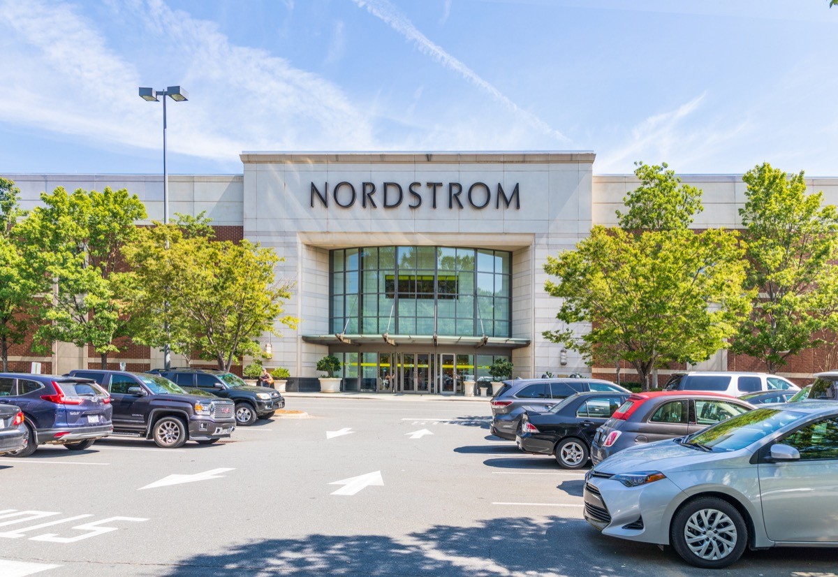 Entrance to Nordstrom Department store, with crowded parking lot on a sunny summer day