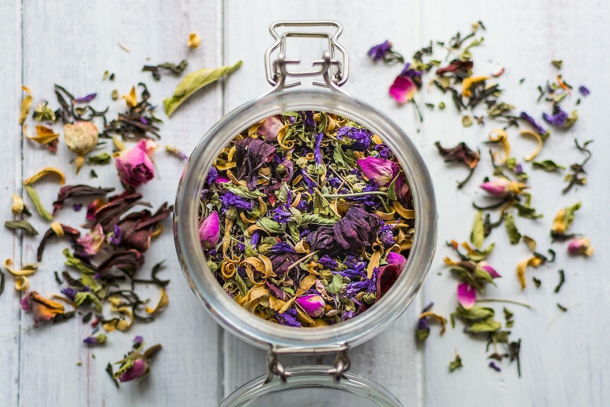 colorful loose chai tea in a glass jar