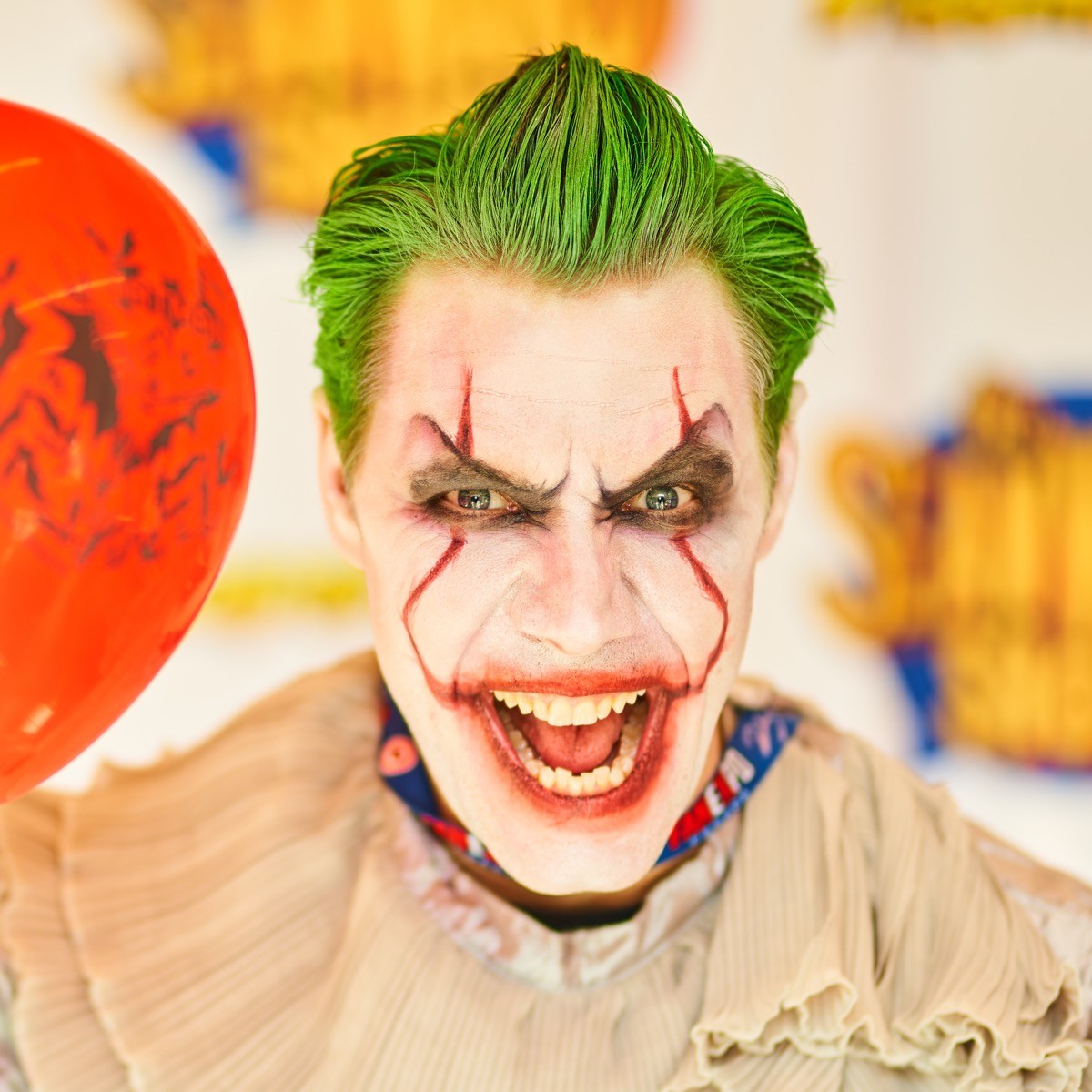 closeup of a man dressed up in a pennywise costume