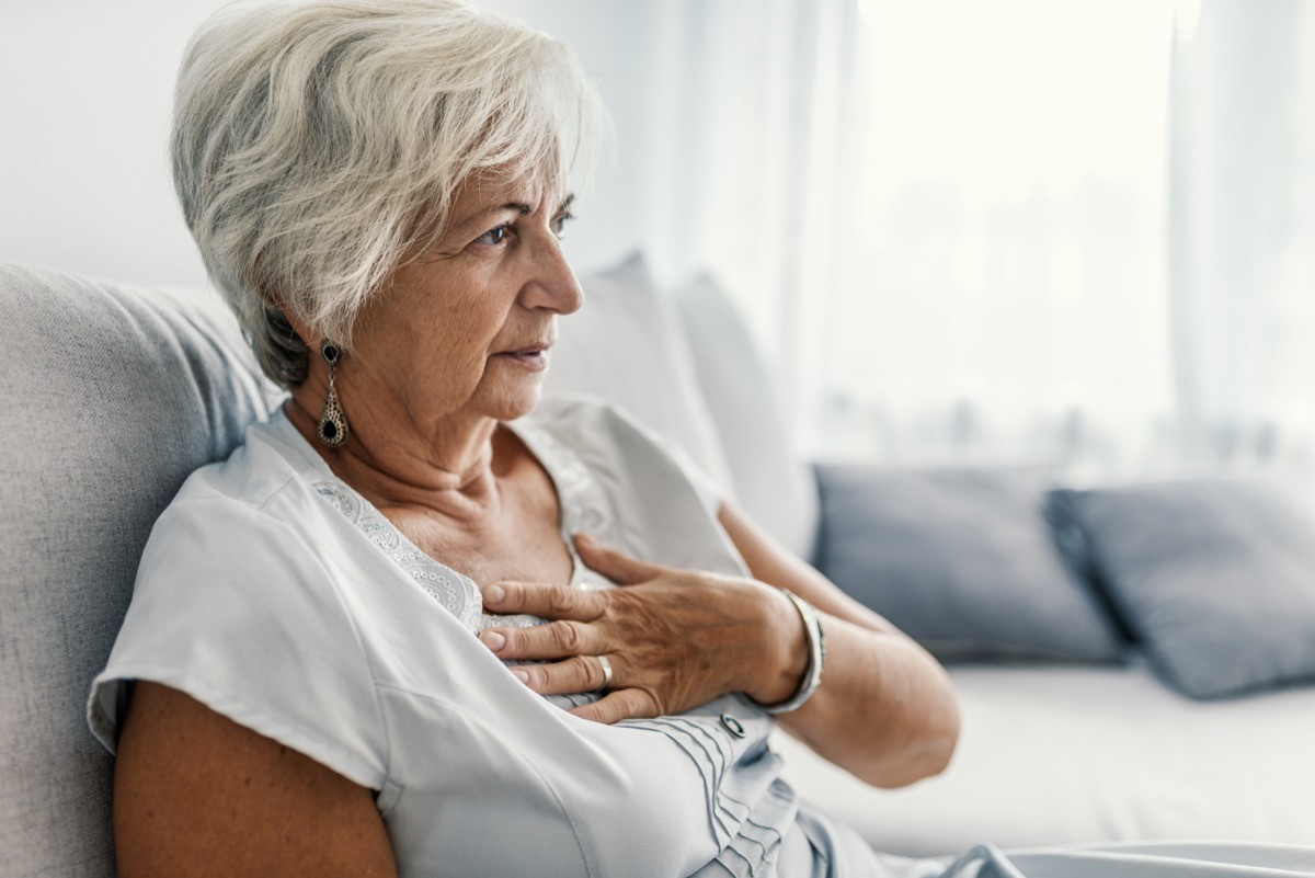 A senior woman experiencing chest pain