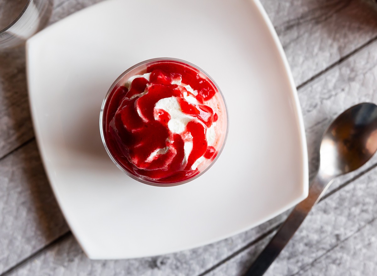 A small portion of dessert on a plate with a spoon