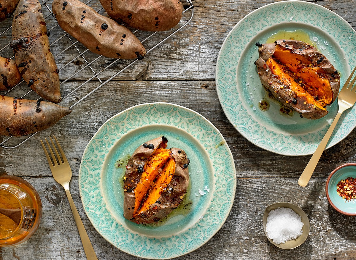 Sweet potatoes on a plate drizzled with vinaigrette