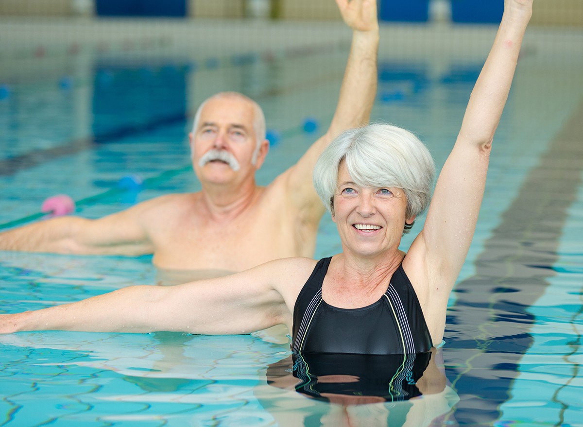 Senior couple exercising in a pool