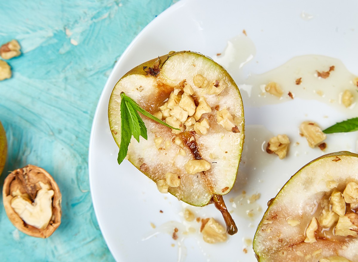 Cut pears with walnuts drizzled with honey