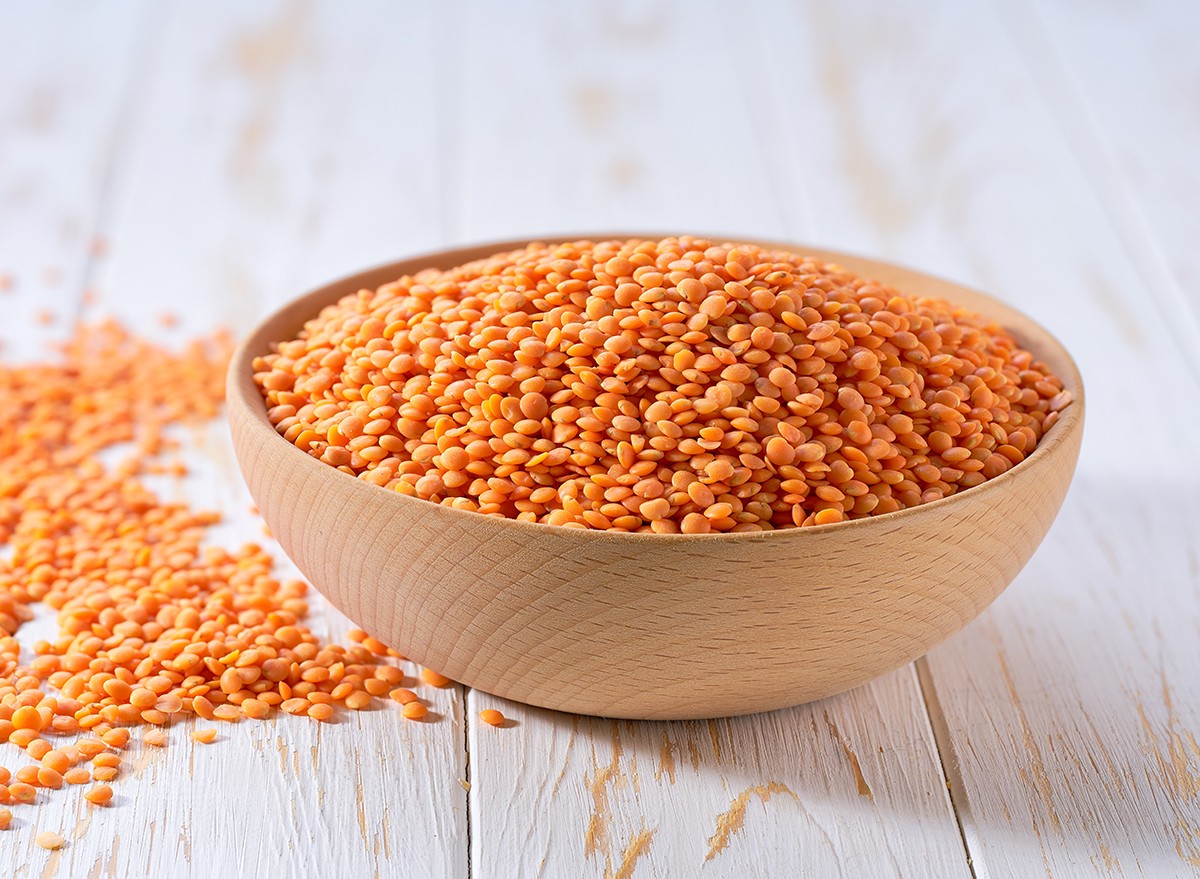 Red lentils in a wooden bowl