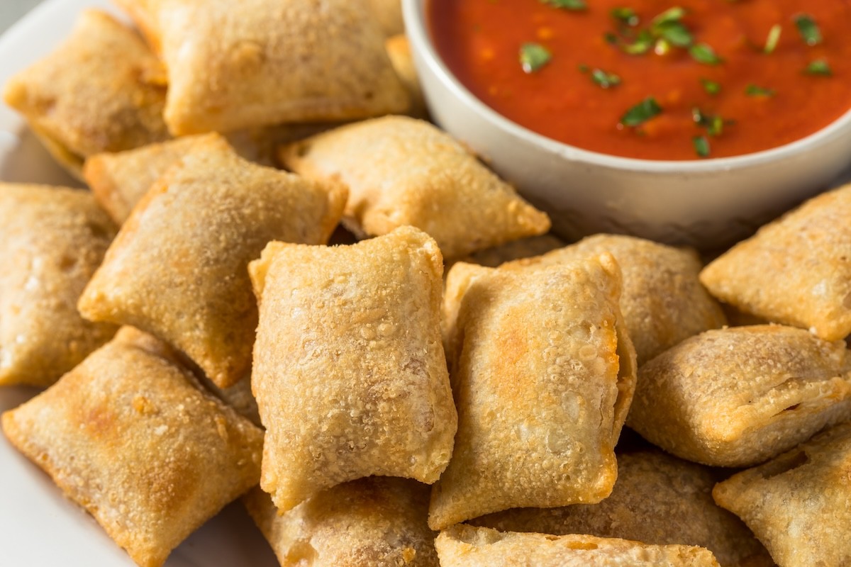 closeup of pizza rolls and marinara sauce