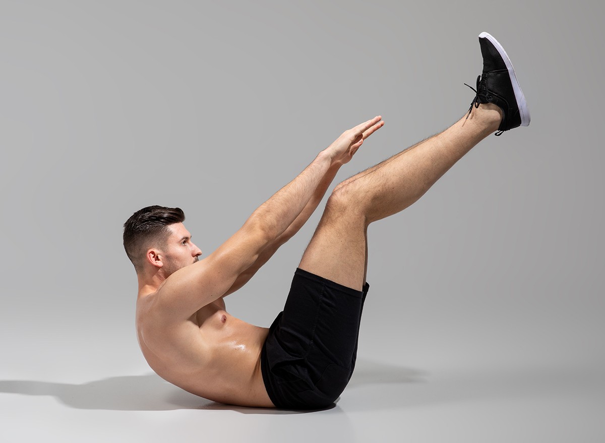 A man doing a hollow body hold