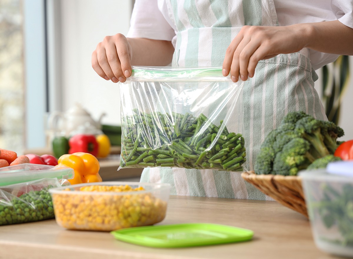 Woman in the kitchen using reusable food storage bags