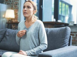 woman going through menopause having a hot flash