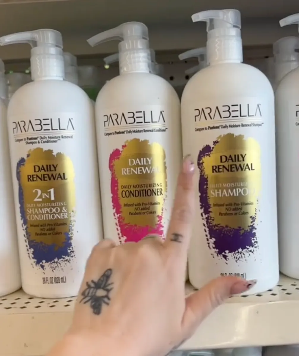 shopper pointing to shampoo at Dollar Tree