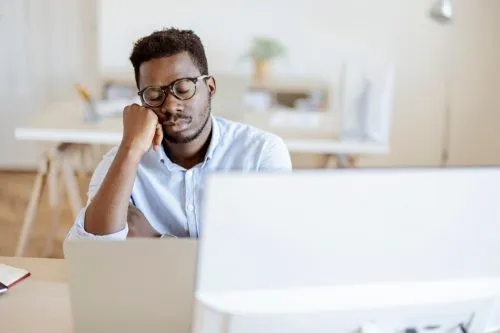 Tired businessman sleeping at his desk