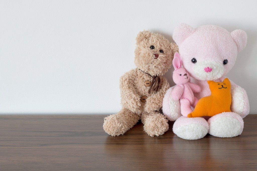 Stuffed animals sitting on a shelf