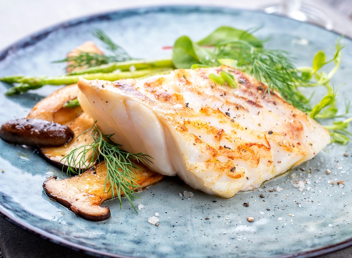 Sea bass served on a plate with mushrooms
