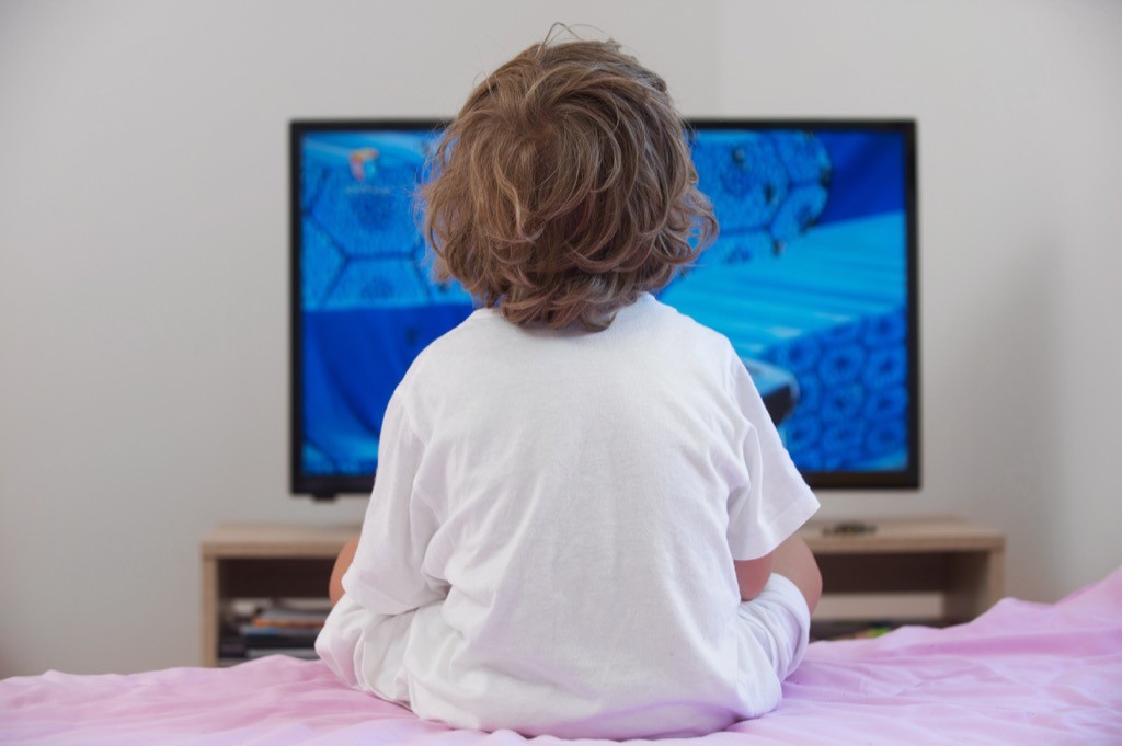 A kid watching tv
