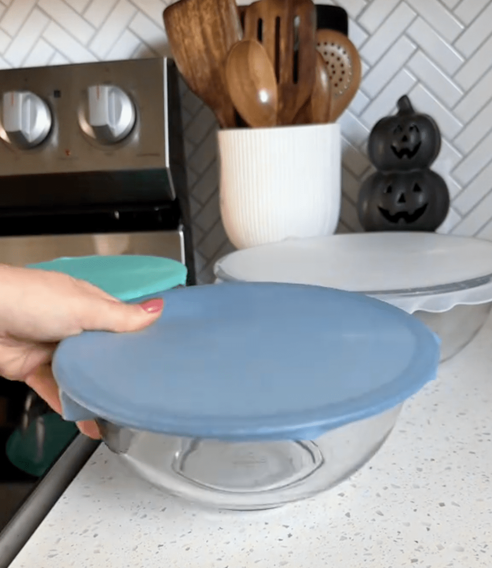 glass bowls with silicone covers on a kitchen counter