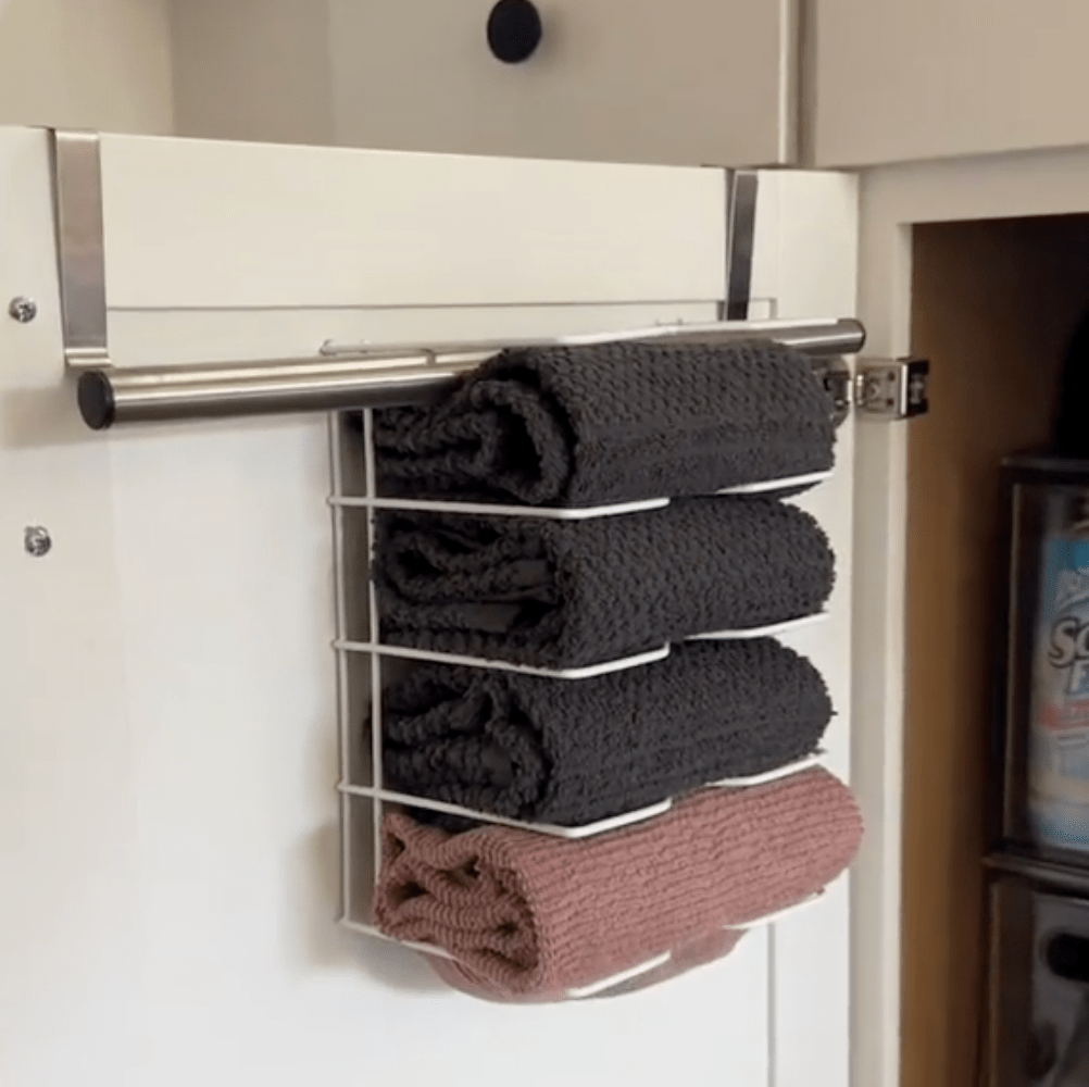 towel holder on the inside of a kitchen cabinet door