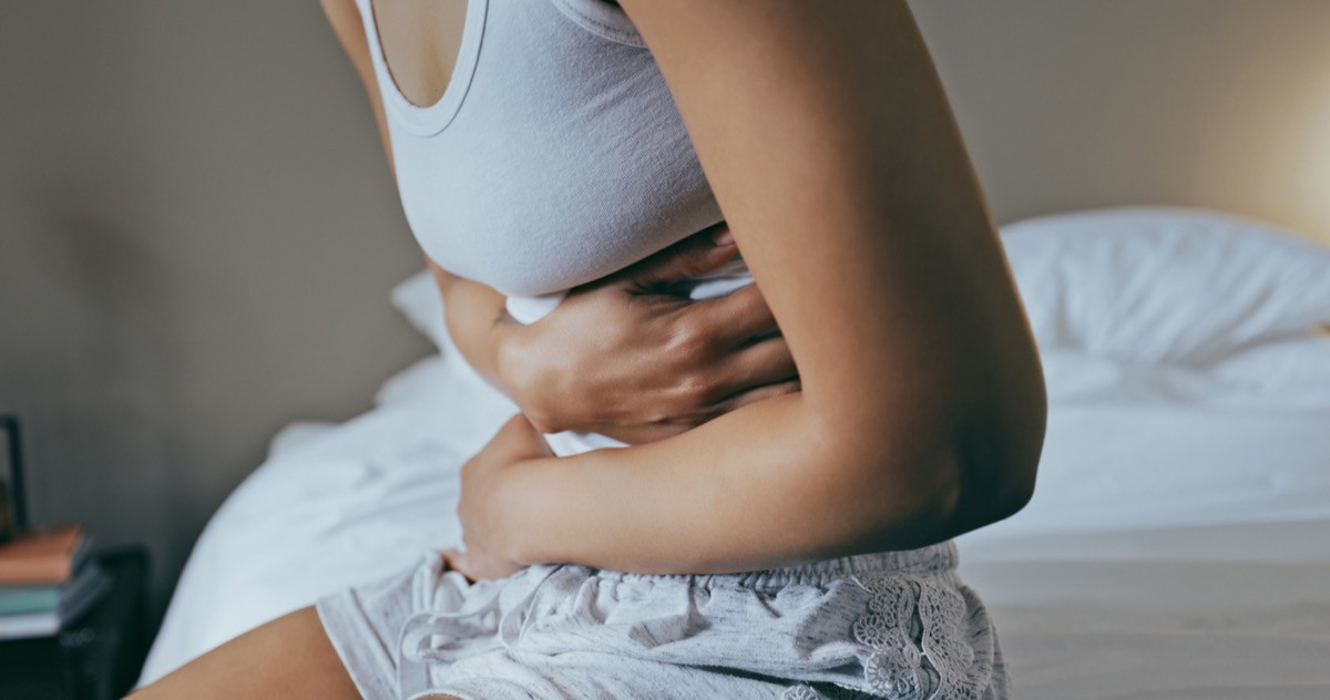 A woman experiencing painful bloating