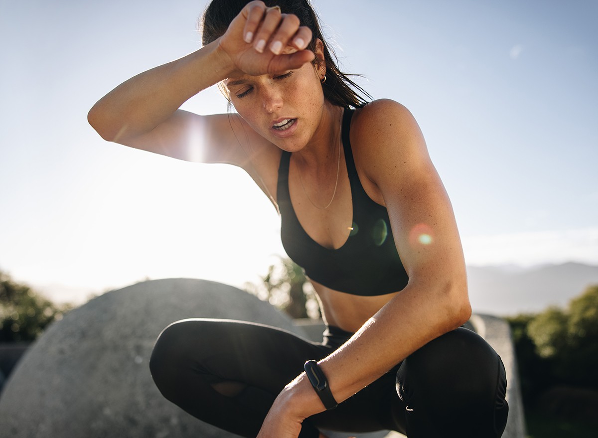 A woman feeling unwell after a workout