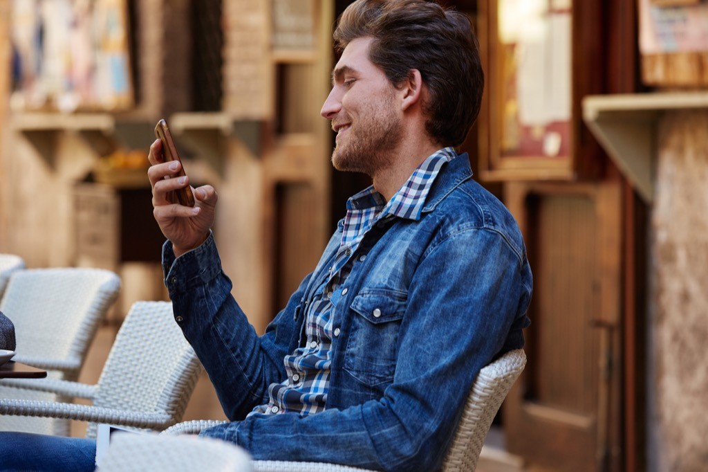 A man using an online banking app on his phone