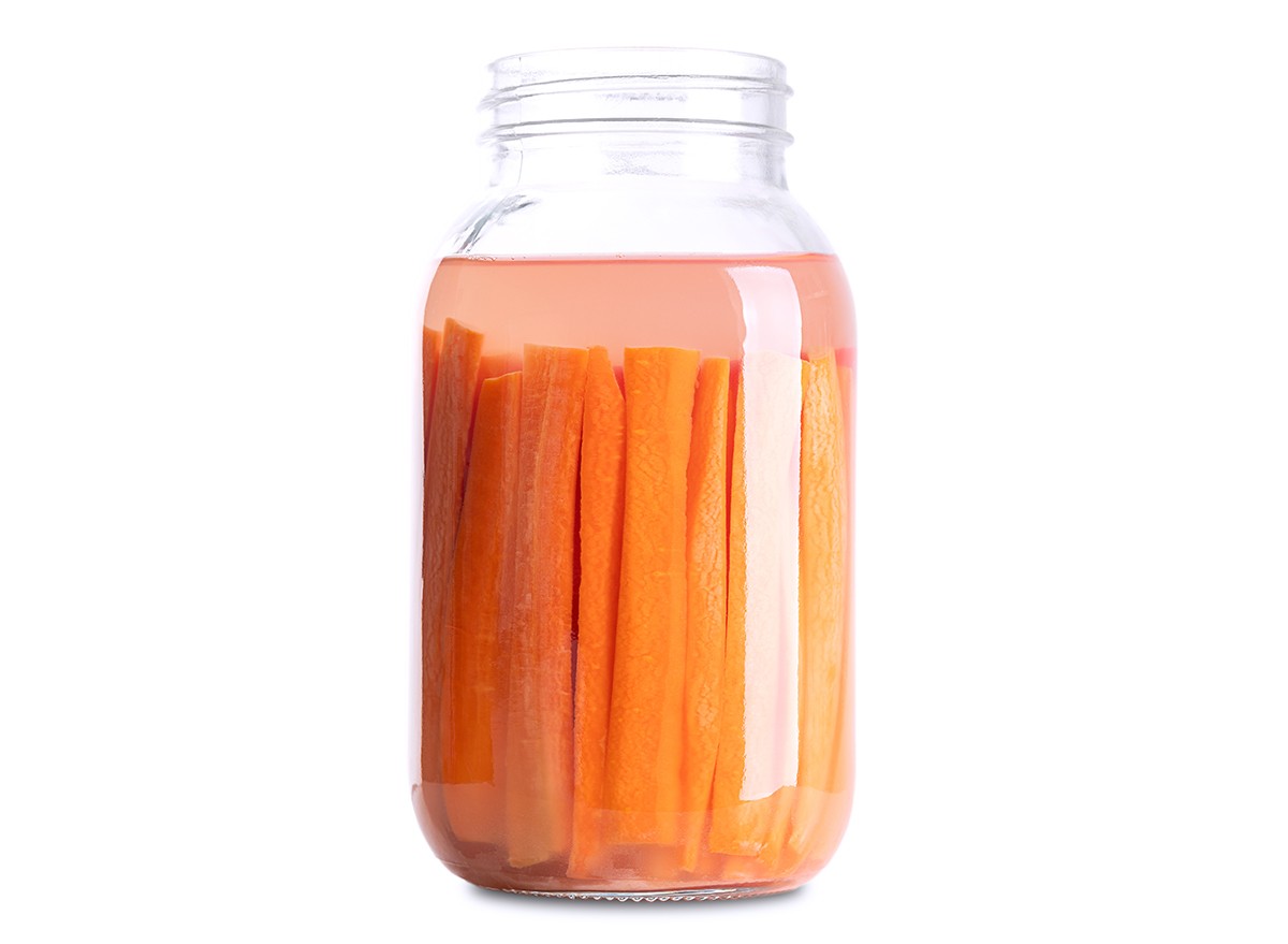 Carrot sticks in a jar of water