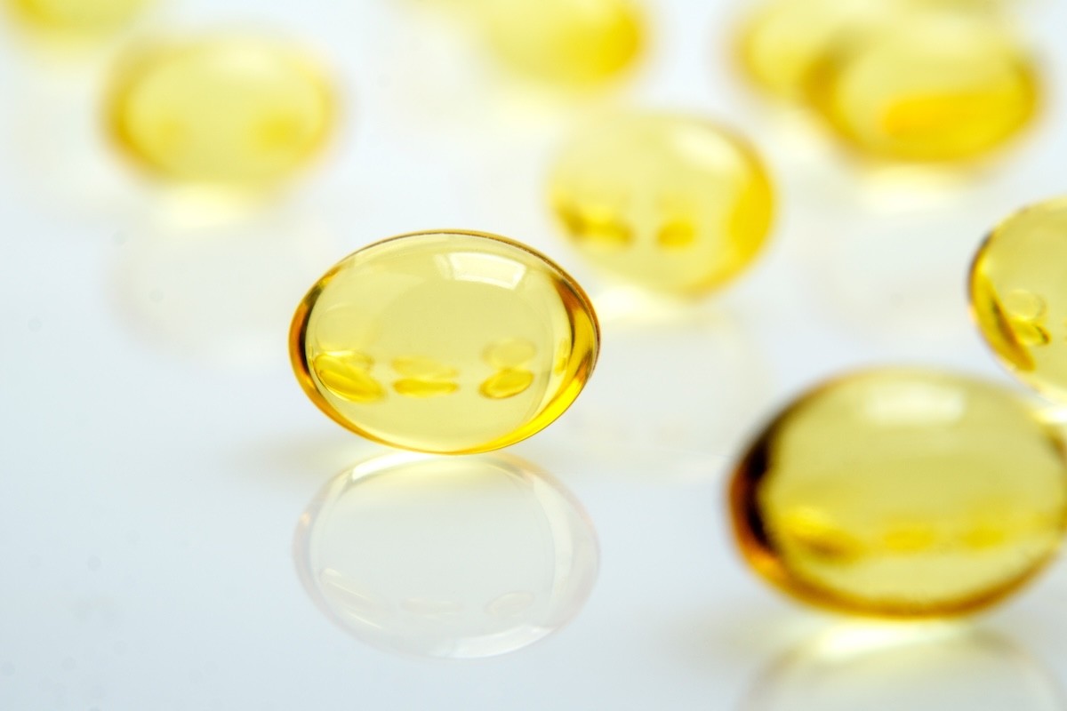 cod liver oil supplements on a white background