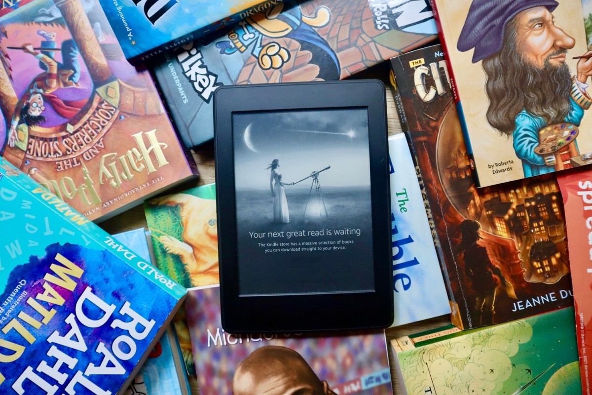kindle on a stack of books