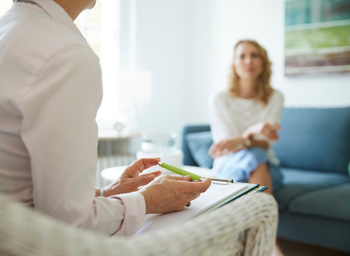 A therapist works with a female client