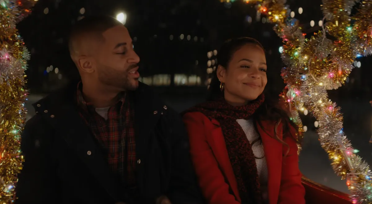 still from the Netflix movie Meet Me Next Christmas, showing actors Christina Milian and Devale Ellis