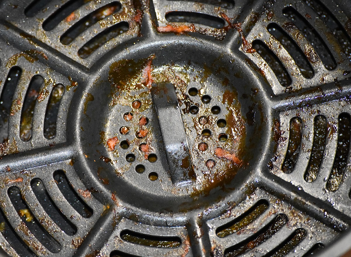 Close-up of a used and unwashed air fryer