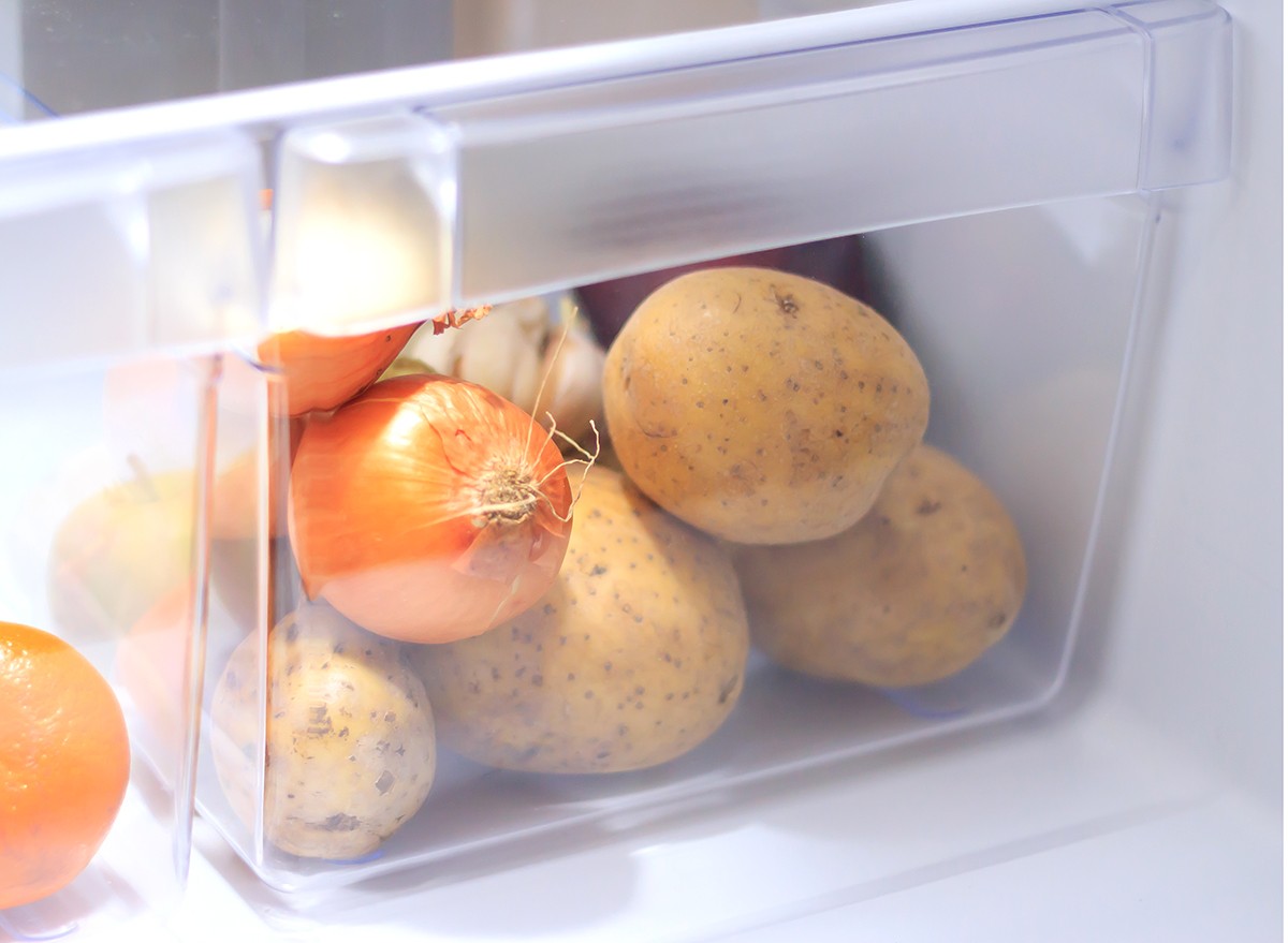 Potatoes in a drawer in a fridge