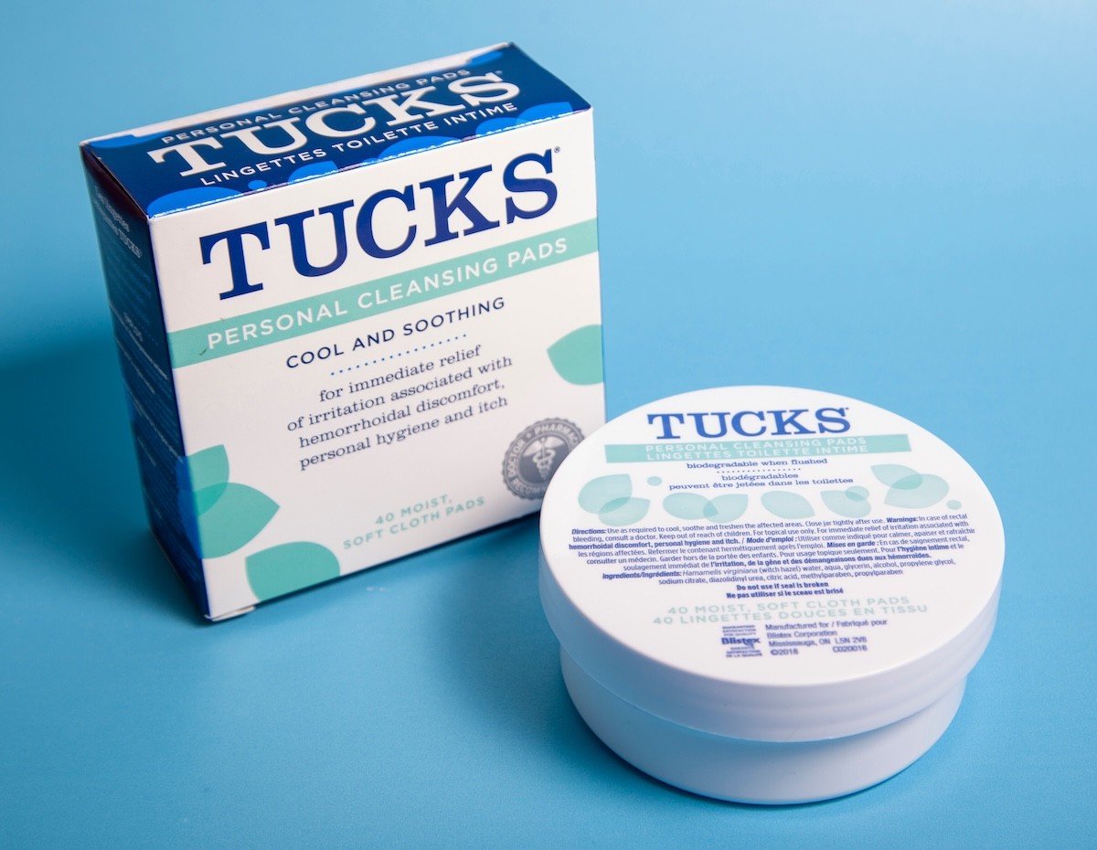tucks hemorrhoid wipes on blue background