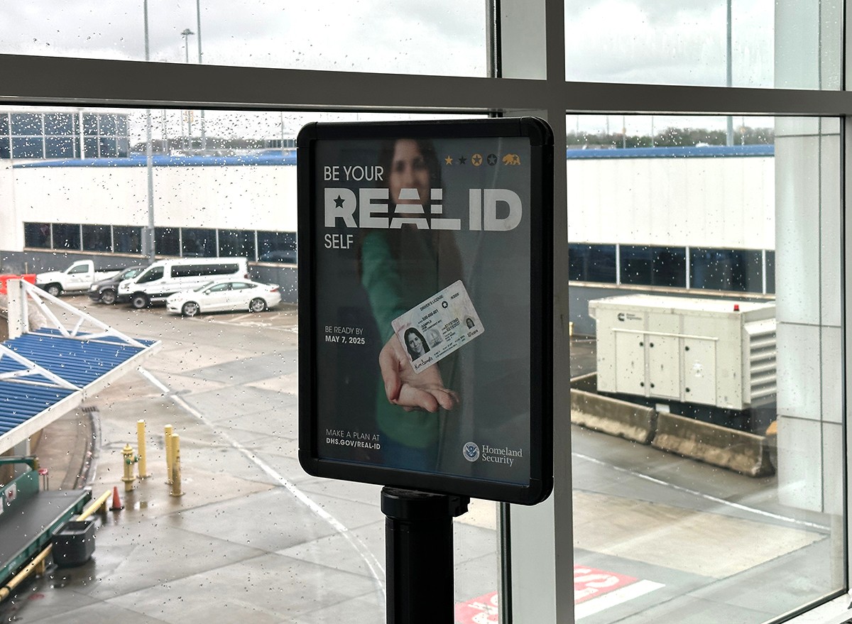 A sign advertising Real ID's at the airport